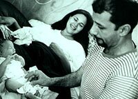 Dad, Mom, and Newborn