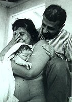 Joy of Natural Birth -- Mom with Partner and Newborn