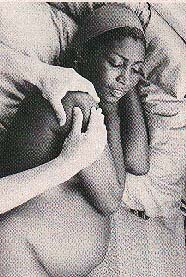 massaging the pregnant mother